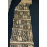 Early 20th century Papua New Guinea bark cloth scroll with geometric design and label inscribed "mat