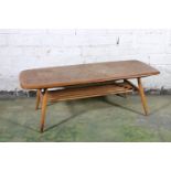 Ercol dark tone model 398 two-tier coffee table, 105cm long.