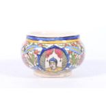 Persian Qajar period pottery bowl decorated in the typical style with vignettes of male figures