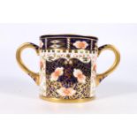 Large Royal Crown Derby Imari palate twin handled loving cup, date mark for 1912, 13.5cm tall.