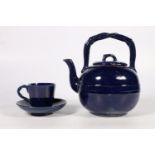 Scottish Pottery, a Dunmore pottery blue glazed tetsubin style teapot and matching cup and