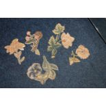 Set of 5 embroidered floral slips, approximately 15cm, Christies sale 5919, lot 349.