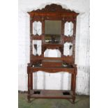 Early 20th century oak hallstand intricately carved with green man  surmount over arrangement of