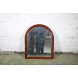 19th century Goncalo Alves style mahogany wall mirror of arched form, with gilt metal beading,