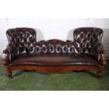 Victorian mahogany Pugin style scroll end boudoir sofa, upholstered in later brown button back