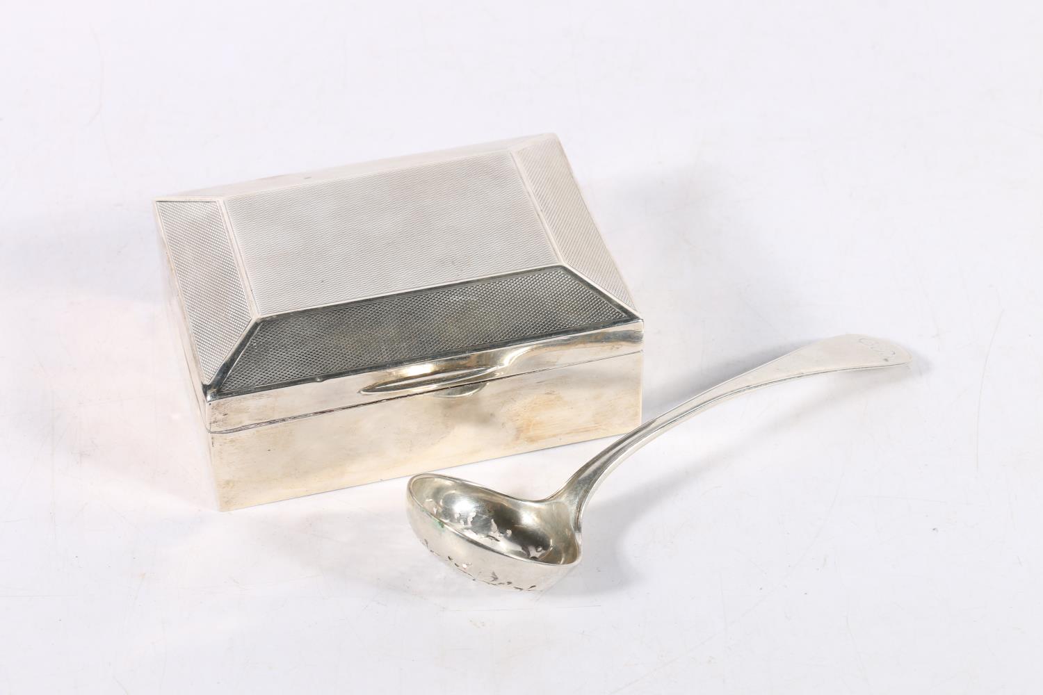 Art Deco silver cigarette box with engine turned decoration, marks rubbed, 11.5cm long, wood