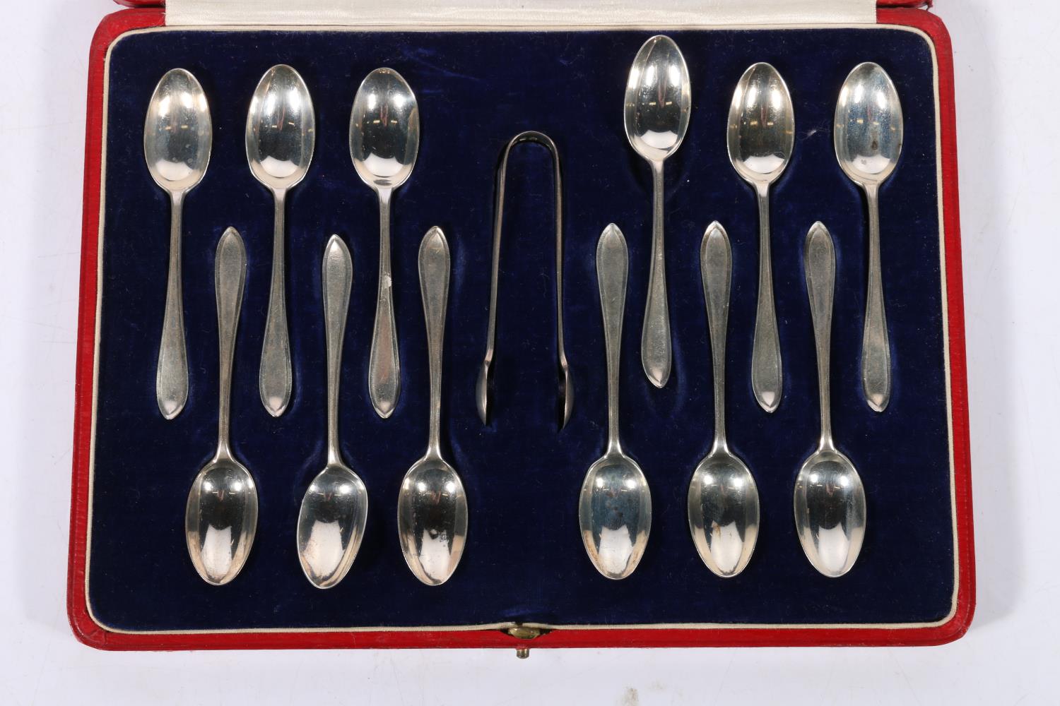 Set of twelve silver teaspoons and sugar tongs by Josiah Williams & Co (David Landsborough