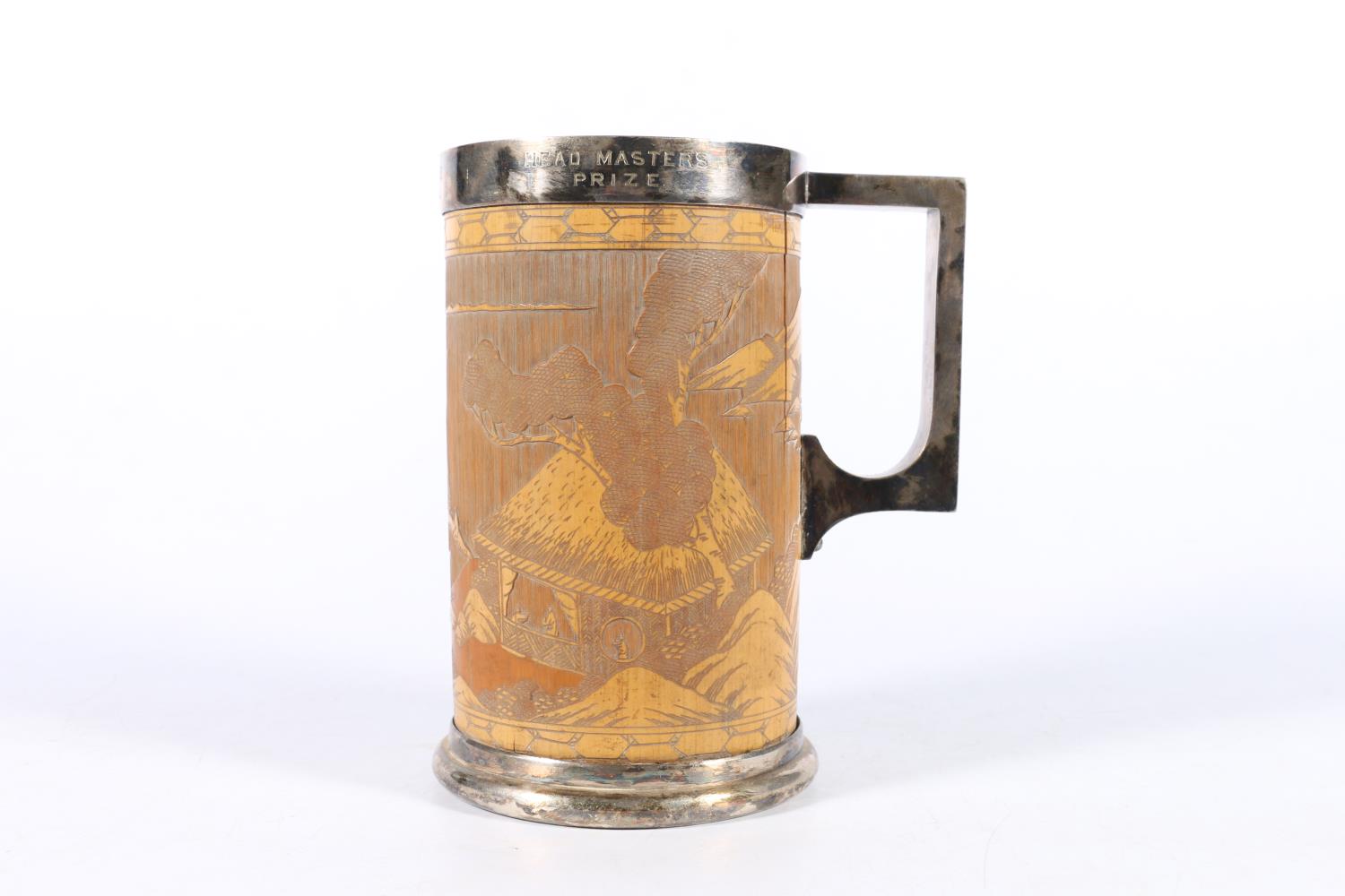 Chinese carved bamboo and white metal prize tankard, the bamboo body depicting a Chinese landscape