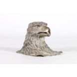 Silver plated cast metal inkwell in the form of an eagle's head, 7cm tall, the base 8.5cm x 8cm.