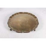 George VI silver salver with piecrust edge raised on four whorl supports by Harrison Brothers &