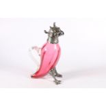 Victorian novelty cranberry glass wine ewer in the form of a parrot with white metal mounts, 28cm