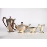 Silver four piece tea service of boat shape with floral bands by Adie Brothers Ltd, Birmingham 1931,