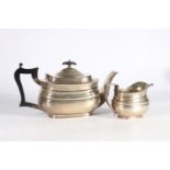 Silver teapot by William Hutton and Sons Limited, Sheffield 1922, with a matching cream jug, 870g