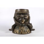 THE MACALLAN ice bucket in the form of a sleeping cask holding fishing bag with fishing flies to his