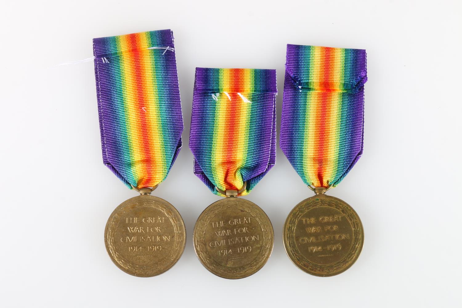 Three WWI Victory medals to include 12410 Lance Corporal Richard M Burns of B Company 2nd - Image 2 of 2