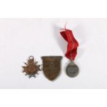 German WWII badges to include a Crimea 'Krim' shield, a 1939 war merit cross and an Eastern medal