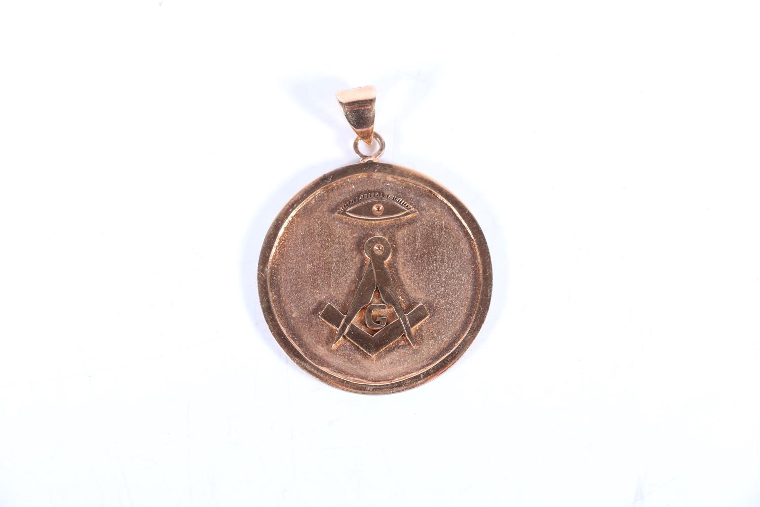 Masonic pendant medal with compass and all seeing eye, the loop stamped '585', possibly 14ct gold,