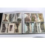 Large black ring binder album containing approximately 575 vintage postcards, mostly English