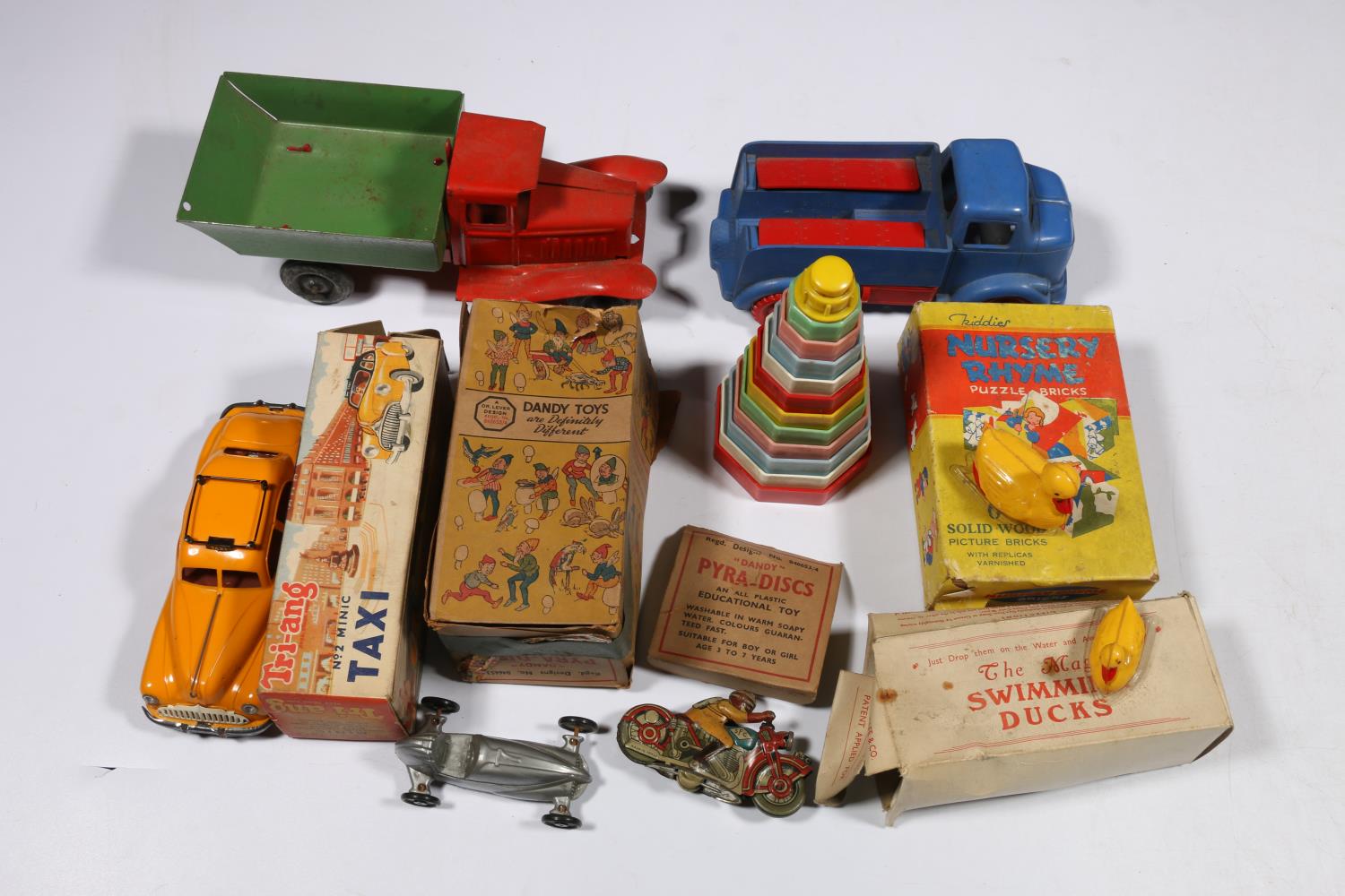 Triang Minic No2 Taxi clockwork plastic model boxed, a Lines Brothers metal truck, a Penguin plastic