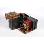 Vintage wooden bellows plate camera 'The Junior Sanderson' with Goerz Patent 7" lens, in case with