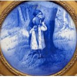 19th century Delft porcelain blue and white convex plaque depicting two children hiding by a tree,
