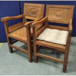 Robert "Mouseman" Thompson two pairs oak dining chairs including two carver armchairs, each with