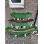 Three tier garden or patio wooden plant stand of angled form with three metal plant troughs, 144cm