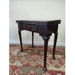 18th century mahogany card table, the shaped top opening  to reveal four square wells and a later