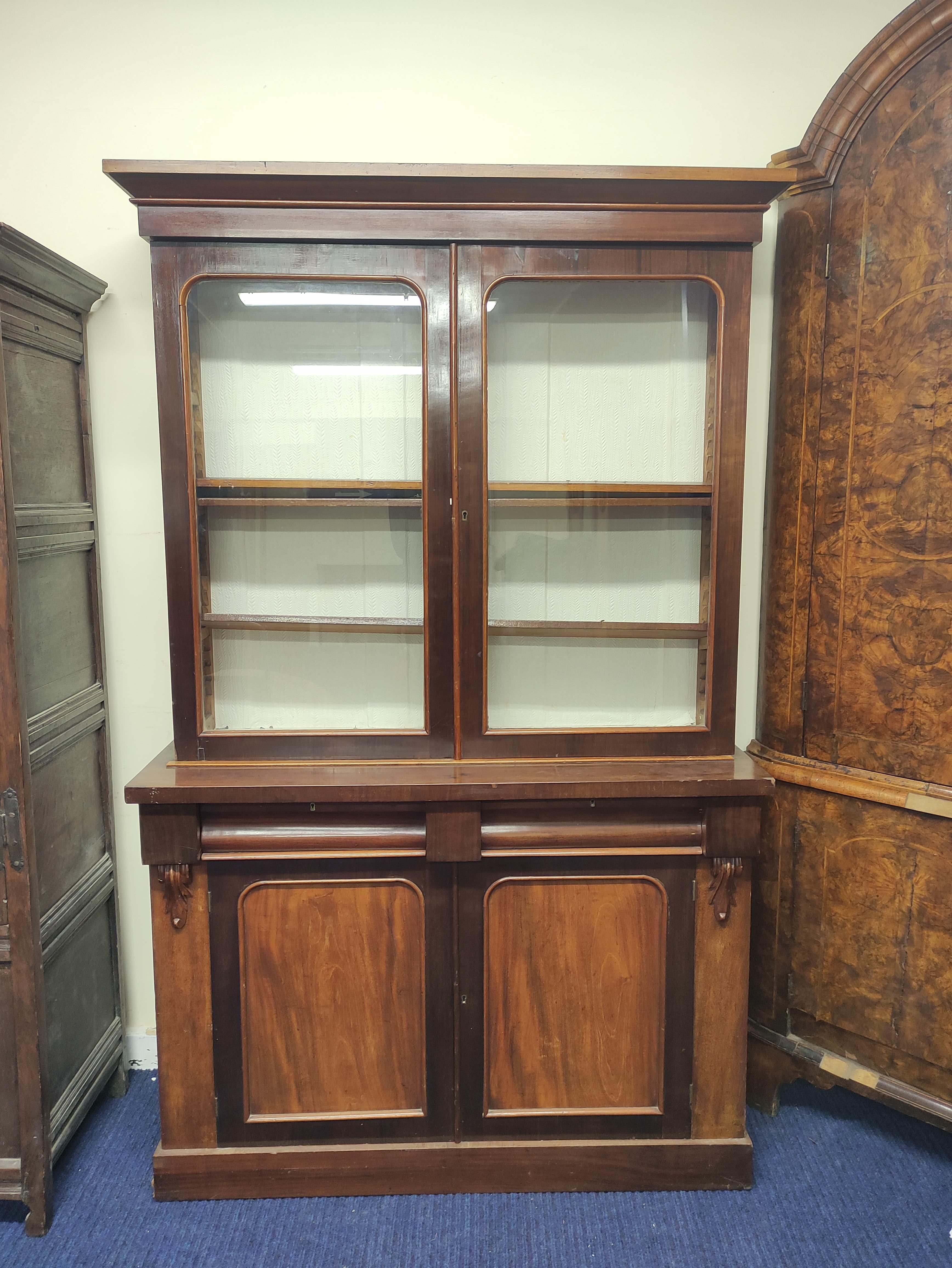 Late 19th century mahogany and beech cabinet bookcase, the glazed upper section above lower