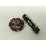 Victorian gold and onyx brooch and another Vulcanite with gold beads. (2).