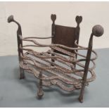 Antique wrought metal fire basket with wavy rail edge, 46cm wide.