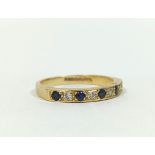 Sapphire and pearl half eternity ring in 18ct gold 2.5g. Size 'K'