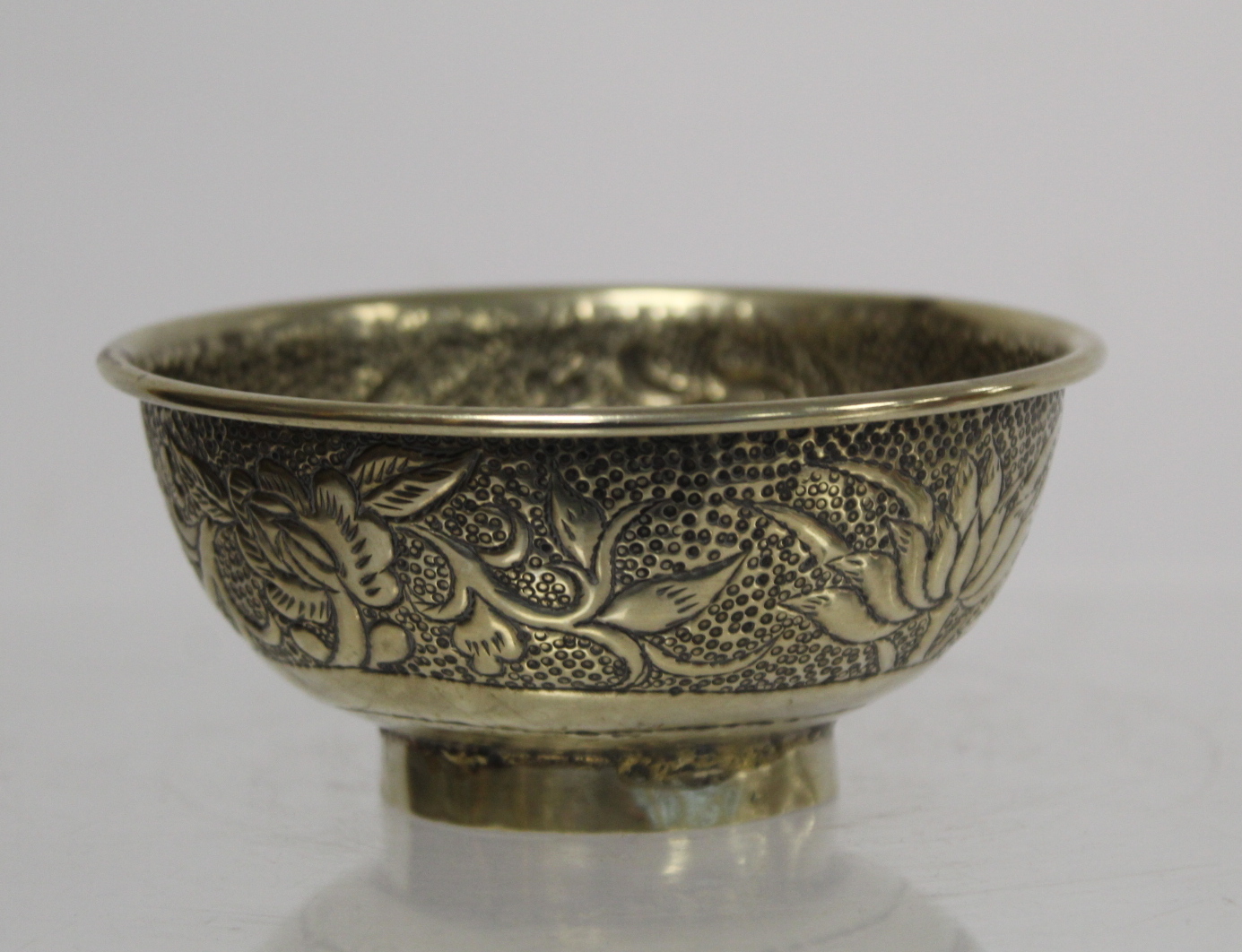 Chinese small white metal bowl with repousse floral band to exterior and two punched character marks - Image 5 of 13