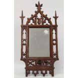Victorian small dressing table mirror, the rectangular glass in pierced and carved walnut gothic