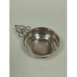Silver bleeding bowl of 18th century style, with pierced hand, Britannia Standard by Elkington,