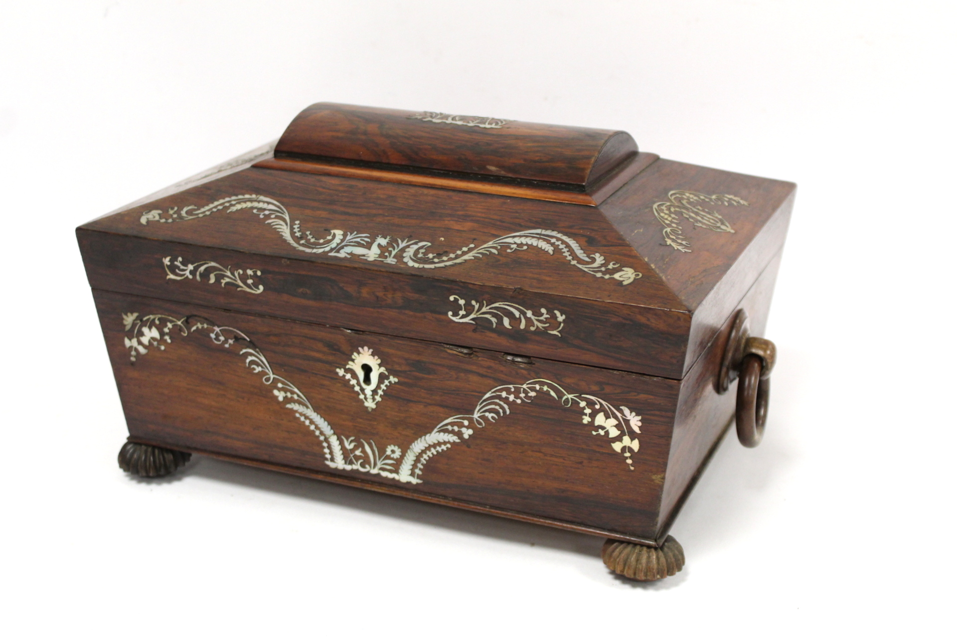 Early 19th century Regency rosewood workbox of twin handled sarcophagus form on four reeded bun