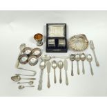Silver butter shell, six napkin rings, a baluster caster and various items of flatware.
