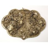 Chinese mottled brown and white carved soapstone panel of lobed oval form decorated with a figure of