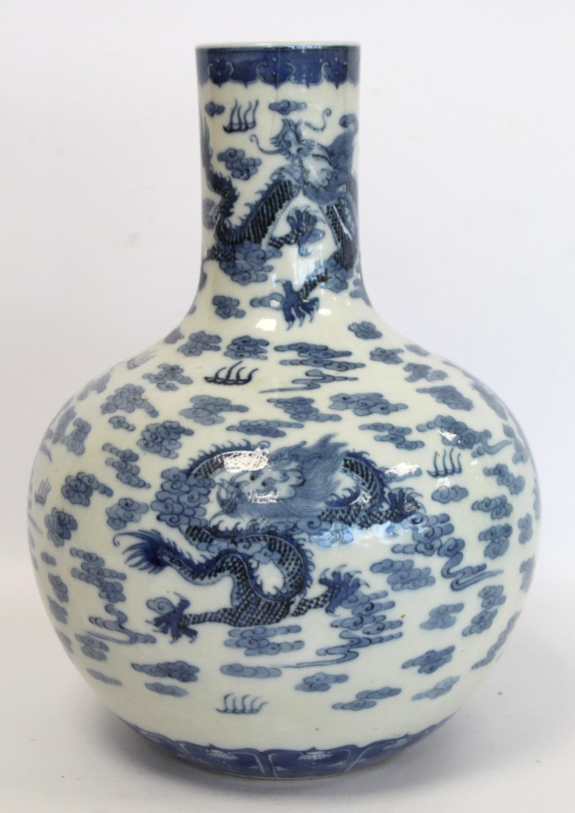 Chinese Qing dynasty large blue and white bottle vase decorated with five five-clawed scrolling