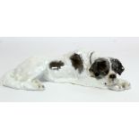 Rosenthal porcelain figure of a dog, sleeping St. Bernard, no. K262/2, c.1922, 30cm long.