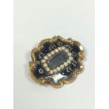 Victorian gold mourning brooch with pearls and black enamel, inscribed and dated 1840.