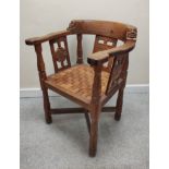 Robert "Mouseman" Thompson, "monk's" oak tub armchair, the top rail terminating in carved masks, the