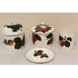 Four pieces of Plichta pottery decorated with fruit, comprising; two covered pots (one a/f),