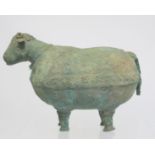 Archaistic naive hollow bronze figure of a ram, the rotund body with rivet effect band and collar