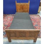 Robert "Mouseman" Thompson oak single bed, the four panel headboard inscribed "In malice be ye babes