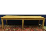 Large pine rectangular  kitchen table on six square tapering supports, 68cm wide, 260cm long.