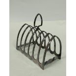 Silver toast rack for six slices and a part fluted jug. (2).