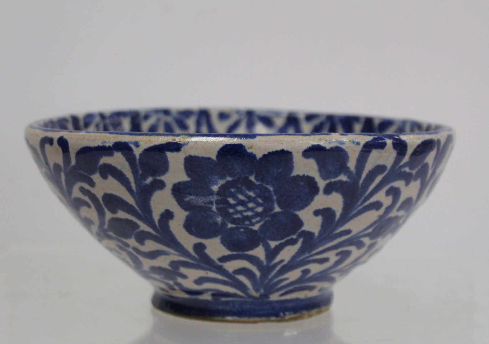 Middle Eastern small earthenware blue and white circular bowl decorated with stylised flowers and - Image 11 of 12