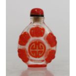 Chinese glass red overlay snuff bottle carved with lucky bats and auspicious symbols, 6cm high.