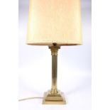 Antique brass Corinthian column table lamp with reeded column and stepped square base, 42cm tall